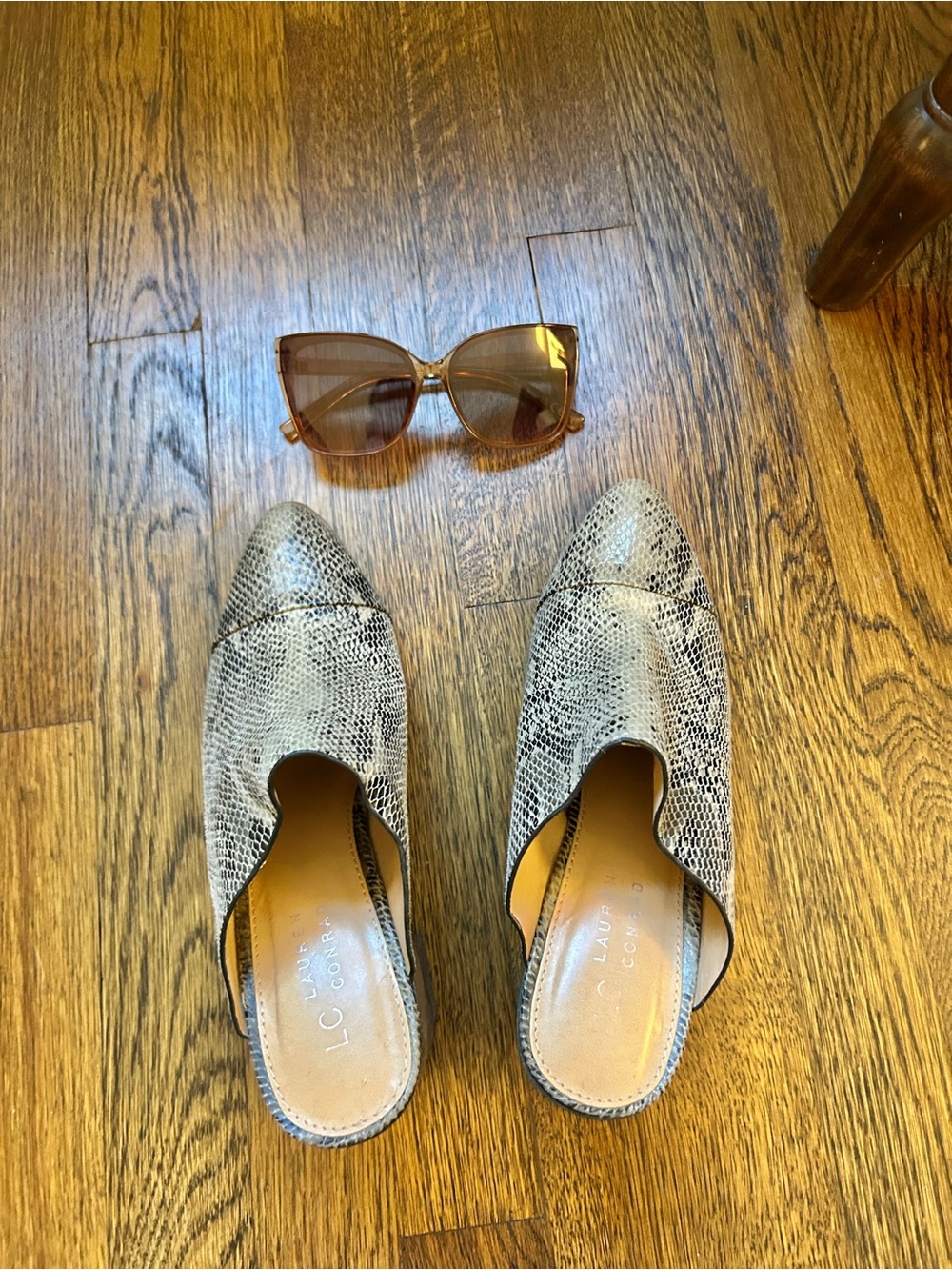 Snake-Print Slip-On Mules and brown frameless sunglasses